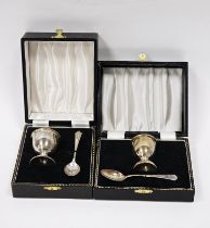 A silver egg cup and spoon christening set, Birmingham 1968; together with another egg cup,