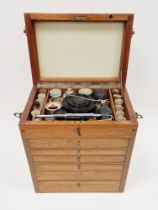 Table top cabinet, fitted with raised lid and drawers below containing a quantity of vintage Dentist