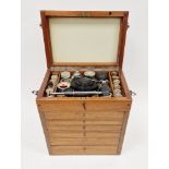 Table top cabinet, fitted with raised lid and drawers below containing a quantity of vintage Dentist