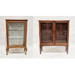 Early 20th century oak glazed display cabinet, the single door opening to reveal two adjustable