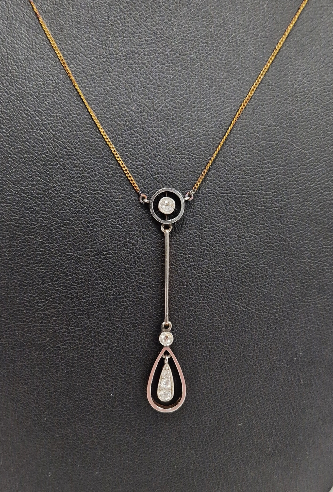 9ct white gold, yellow gold and diamond necklace, having collet set circular pendant above