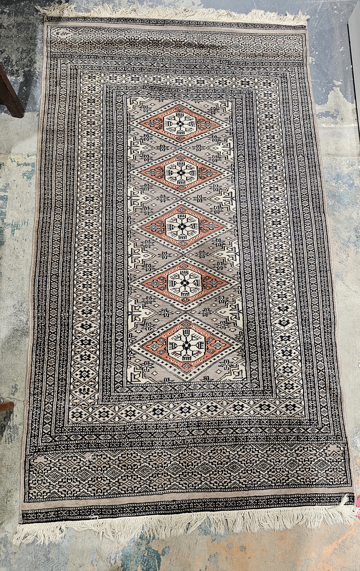 Possibly Afghan grey ground silk rug with five central lozenge medallions on stylised geometric