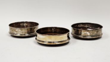 Set of three modern silver wine bottle coasters by Roberts & Dore Ltd, Sheffield, 2005, with