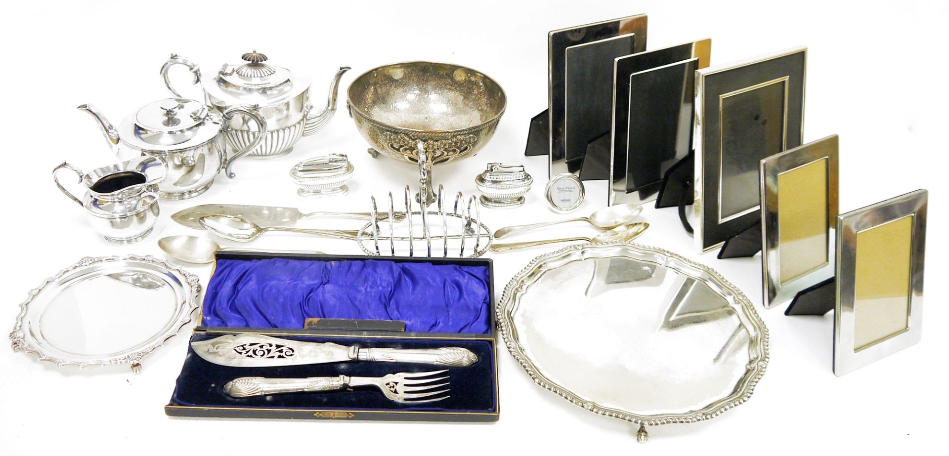 Silver plated salver raised on claw and ball feet, a smaller silver plated card tray, various silver