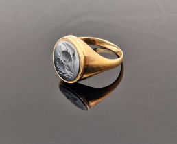 9ct gold and haematite signet ring, the oval haematite engraved with centurion's head