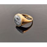 9ct gold and haematite signet ring, the oval haematite engraved with centurion's head