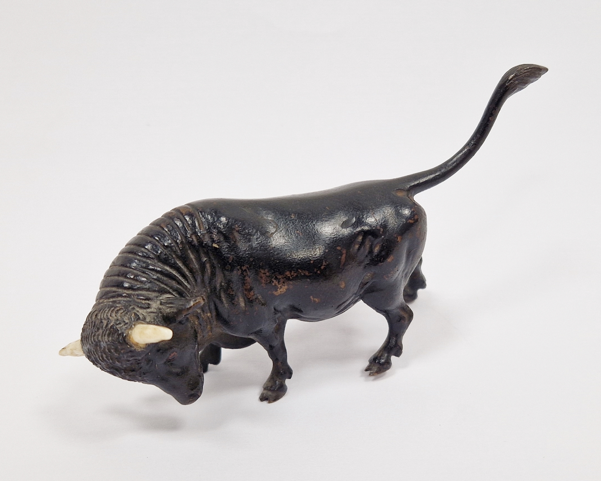 Patinated bronze and bone-mounted miniature model of a bull, 20th century, naturalistically cast - Image 2 of 2