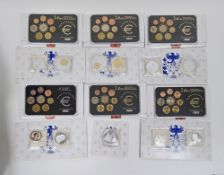 Box containing 13 x Euro coin sets, each set in plastic display, containing the 2 Euro down to 1