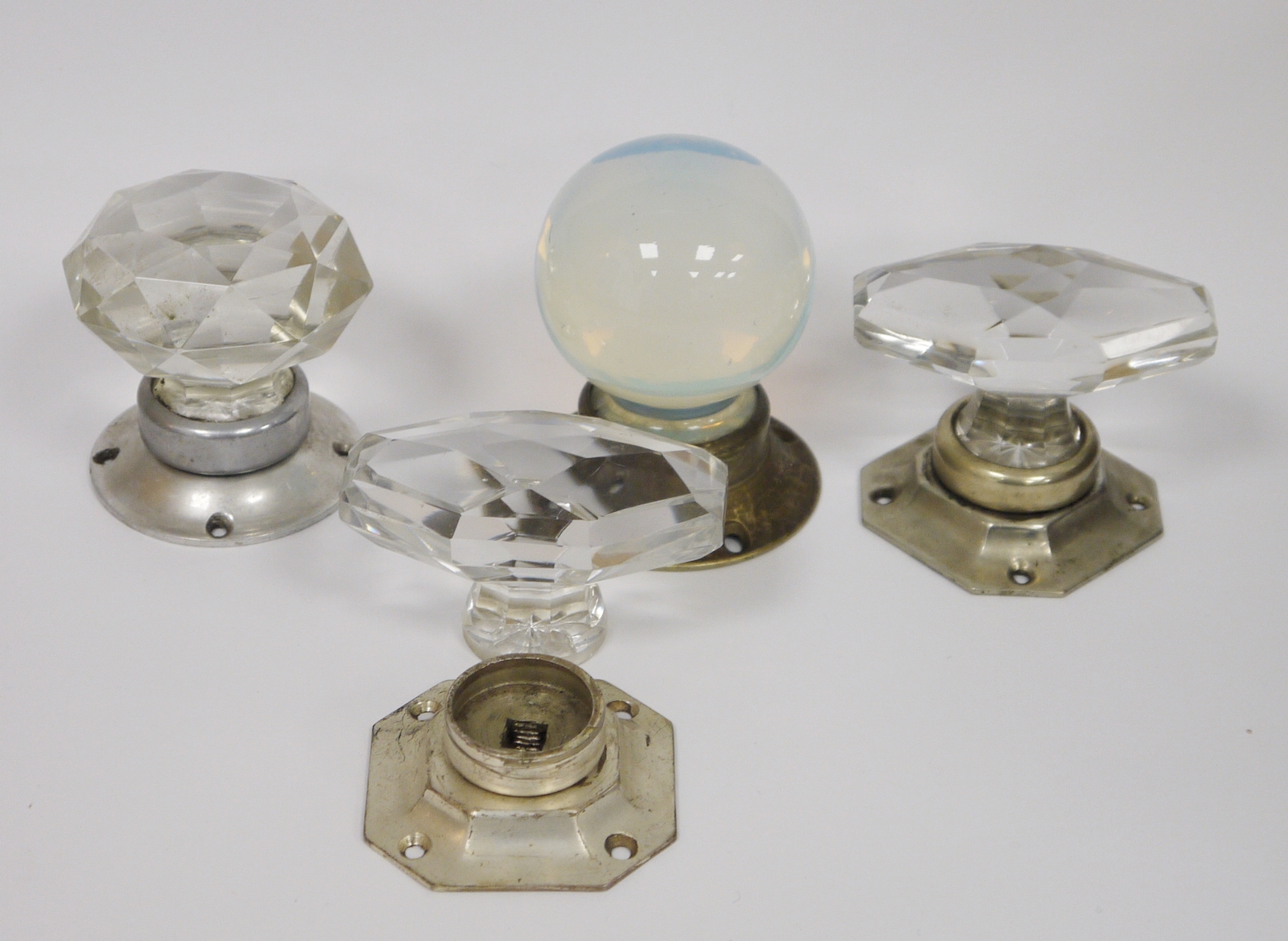 Collection of four early 20th century glass and metal-mounted door knobs comprising a sphere- - Image 2 of 2