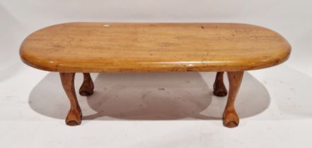 Stained hardwood coffee table of rounded rectangular form, on claw and ball feet, 38cm high x