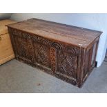 Antique oak coffer of rectangular form, carved geometric motifs from the front panel, 56cm high x