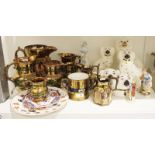 Collection of Staffordshire pottery including a group of copper lustre jugs, a two-handled loving