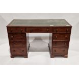 Edwardian mahogany kneehole desk, the green leather top tooled in gilt, above a central frieze