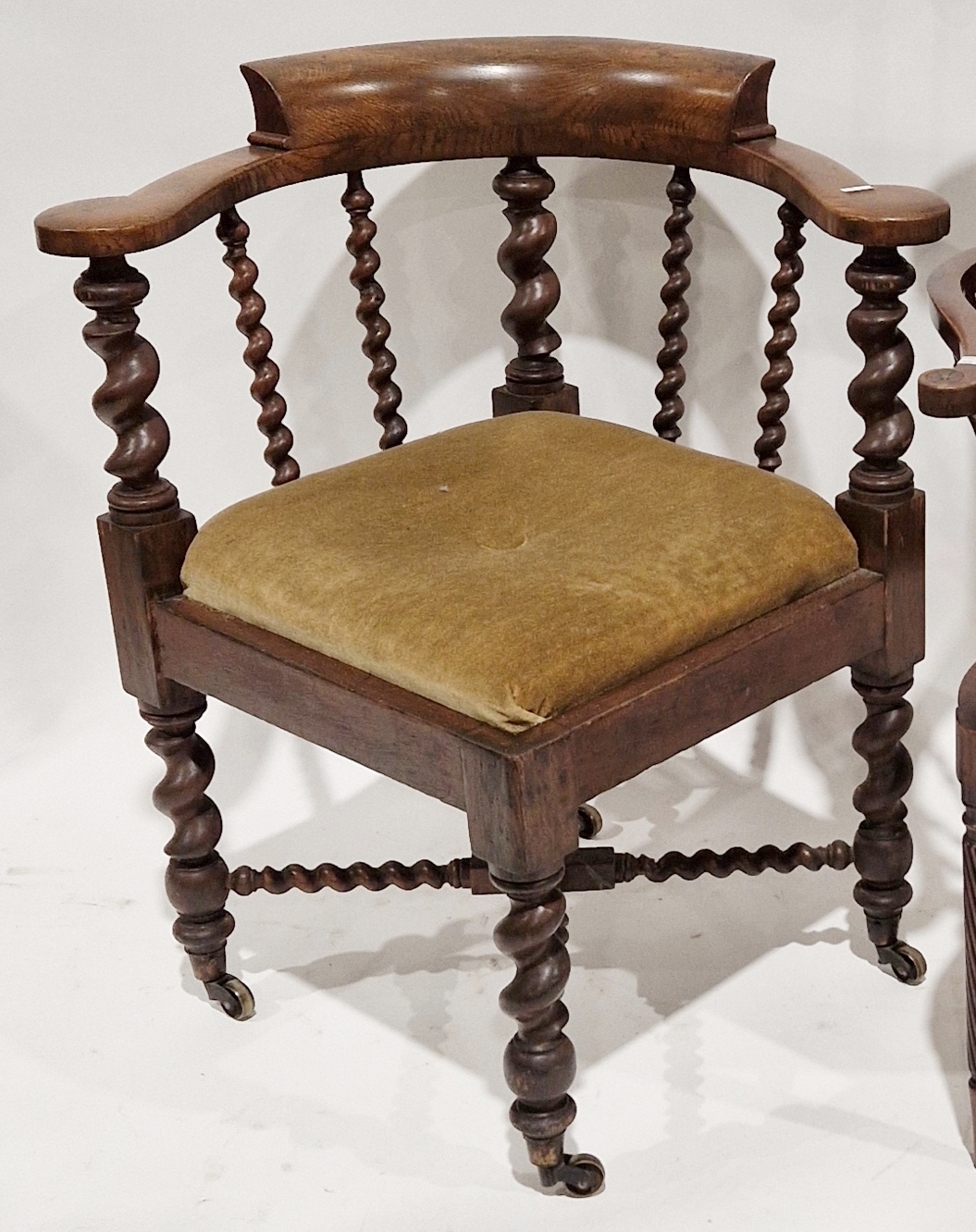 Late 19th/early 20th century oak corner chair with carved spiral supports and X-frame stretcher,