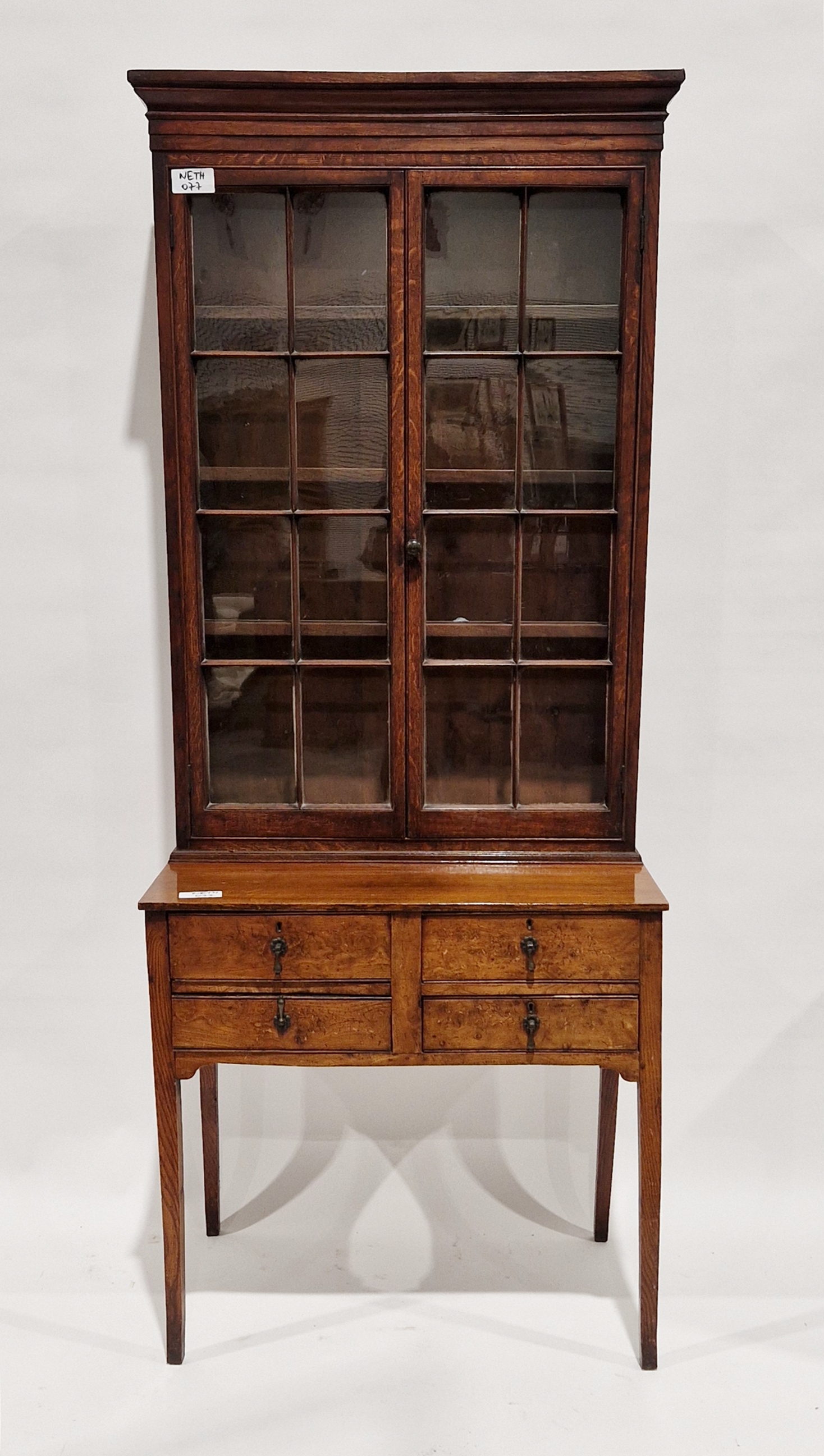 Late 19th/early 20th century bookcase on stand/desk, the two glazed doors opening to reveal three