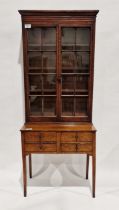 Late 19th/early 20th century bookcase on stand/desk, the two glazed doors opening to reveal three