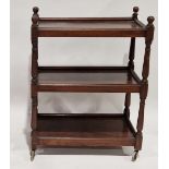 Mahogany and stained wood three-tier afternoon tea trolley on turned uprights and castors, 82cm high