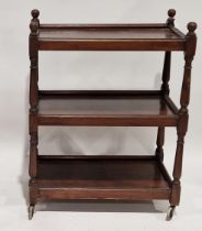 Mahogany and stained wood three-tier afternoon tea trolley on turned uprights and castors, 82cm high