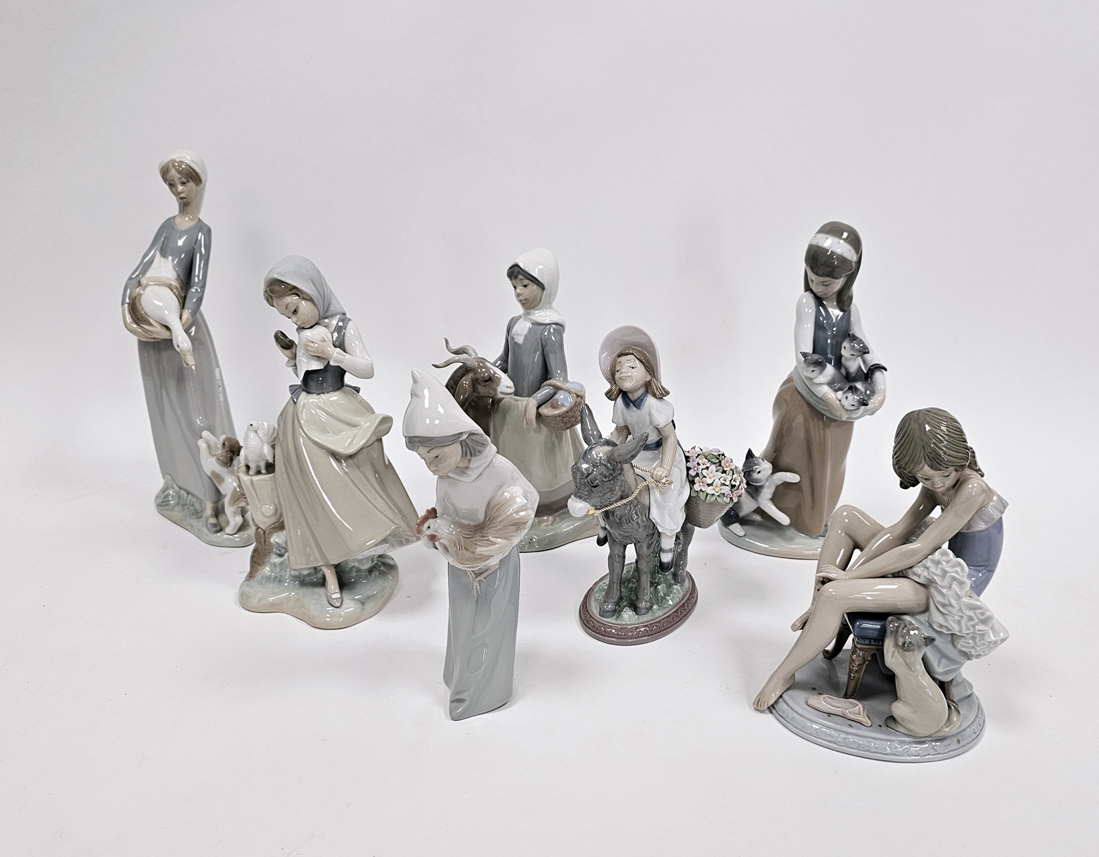 Seven Lladro figures of girls with animals including a ballerina with cat, a girl cradling - Image 6 of 10
