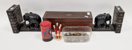 Pair of Ceylon ebony and bone inlaid bookends carved as elephants before books, a 19th century