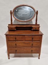 Late Victorian/Edwardian oak dressing chest with oval bevel-edged swing mirror, two jewel drawers,