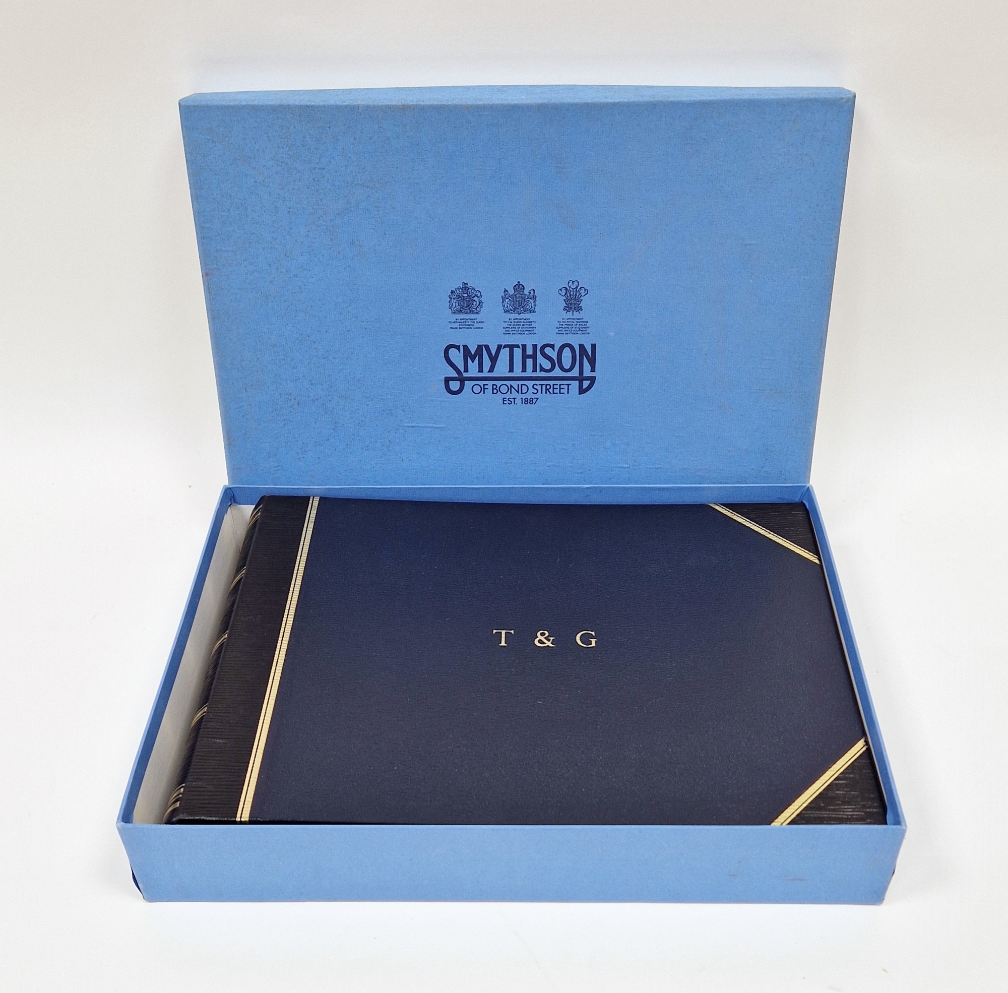 Smythson of Bond Street, dark blue, crushed morocco photo album, gilt rules, initialled T & G on