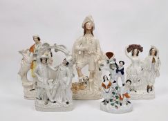 Collection of Victorian Staffordshire pottery flatback figures including a large figure of a