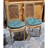 Pair Louis XVI-style bergere and giltwood bedroom chairs, each with stepped square back, circular