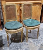 Pair Louis XVI-style bergere and giltwood bedroom chairs, each with stepped square back, circular