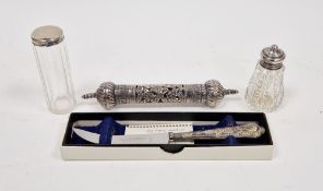 Silver-mounted cut glass toilet bottle, a silver-mounted cut glass pepper pot, a silver-handled