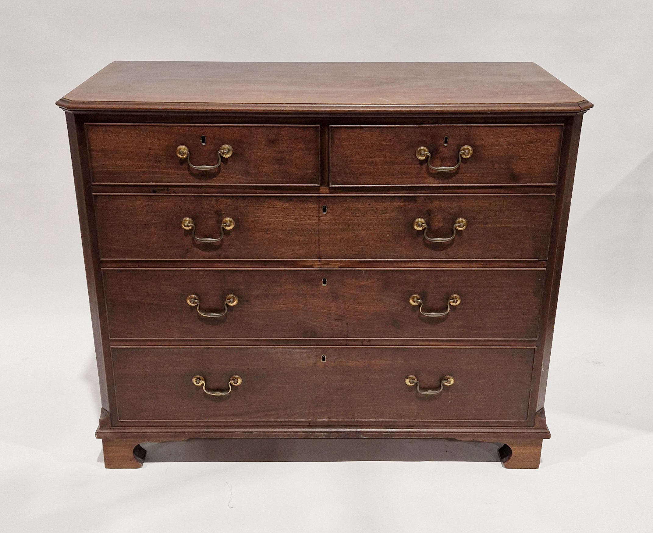 19th century mahogany chest of drawers of canted rectangular form, ebony stringing on the canted