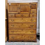 20th century stained wood three-section chest/storage cupboard with an array of drawers and three