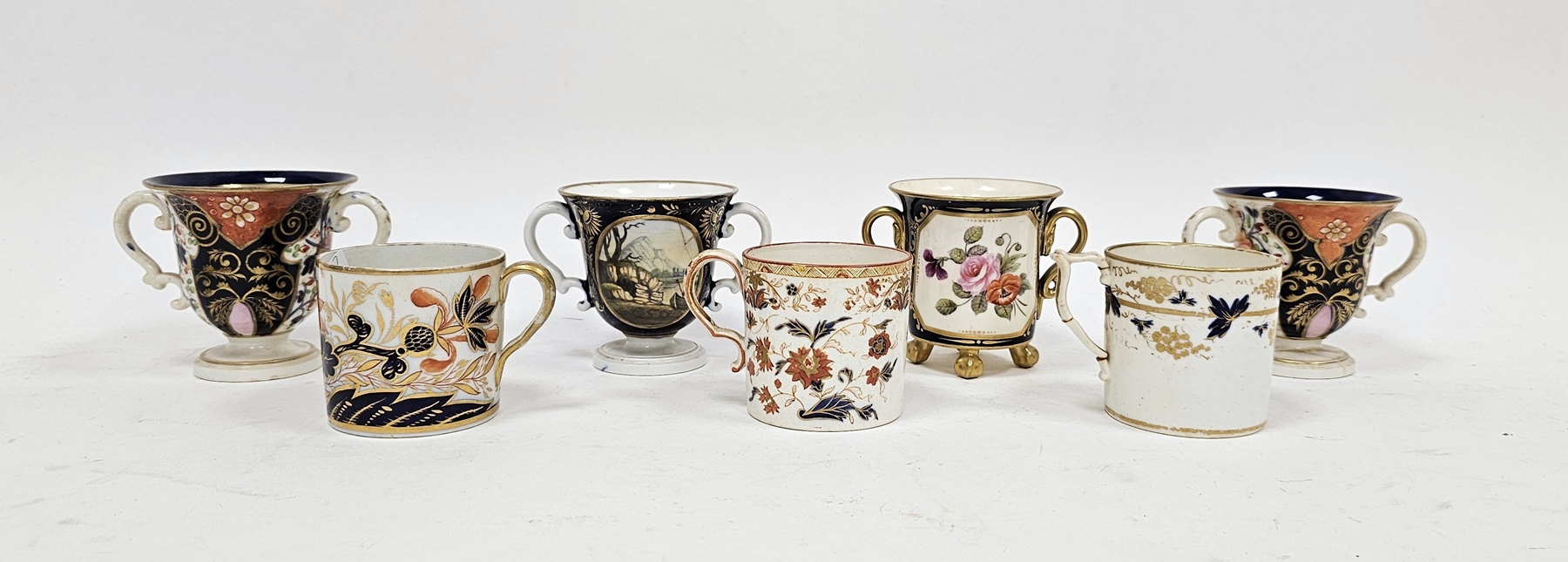 Group of Derby porcelain two-handled cups and a group of English porcelain coffee cans, circa 1820'