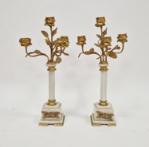 Pair French-style gilt metal and white marble floral candelabra, each four-light with flowerhead