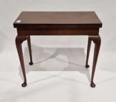 Georgian-style mahogany folding rectangular games table, the hinged top with floral tapestry cover