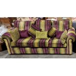 Duresta three-seater sofa covered in a multi-coloured fabric, with a selection of cushions, 225cm
