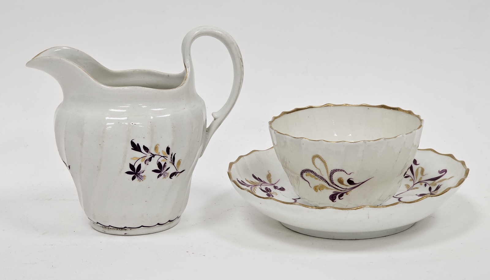 Worcester 'Flight' porcelain spirally moulded tea bowl and saucer and a milk jug, circa 1790, puce