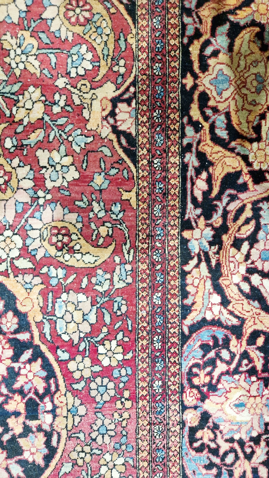 Eastern wool rug of Persian design, having black arabesque to the cherry red field with allover - Image 9 of 32