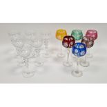 Harlequin coloured set of six cut hock glasses, each with tinted bowl engraved with starburst, on