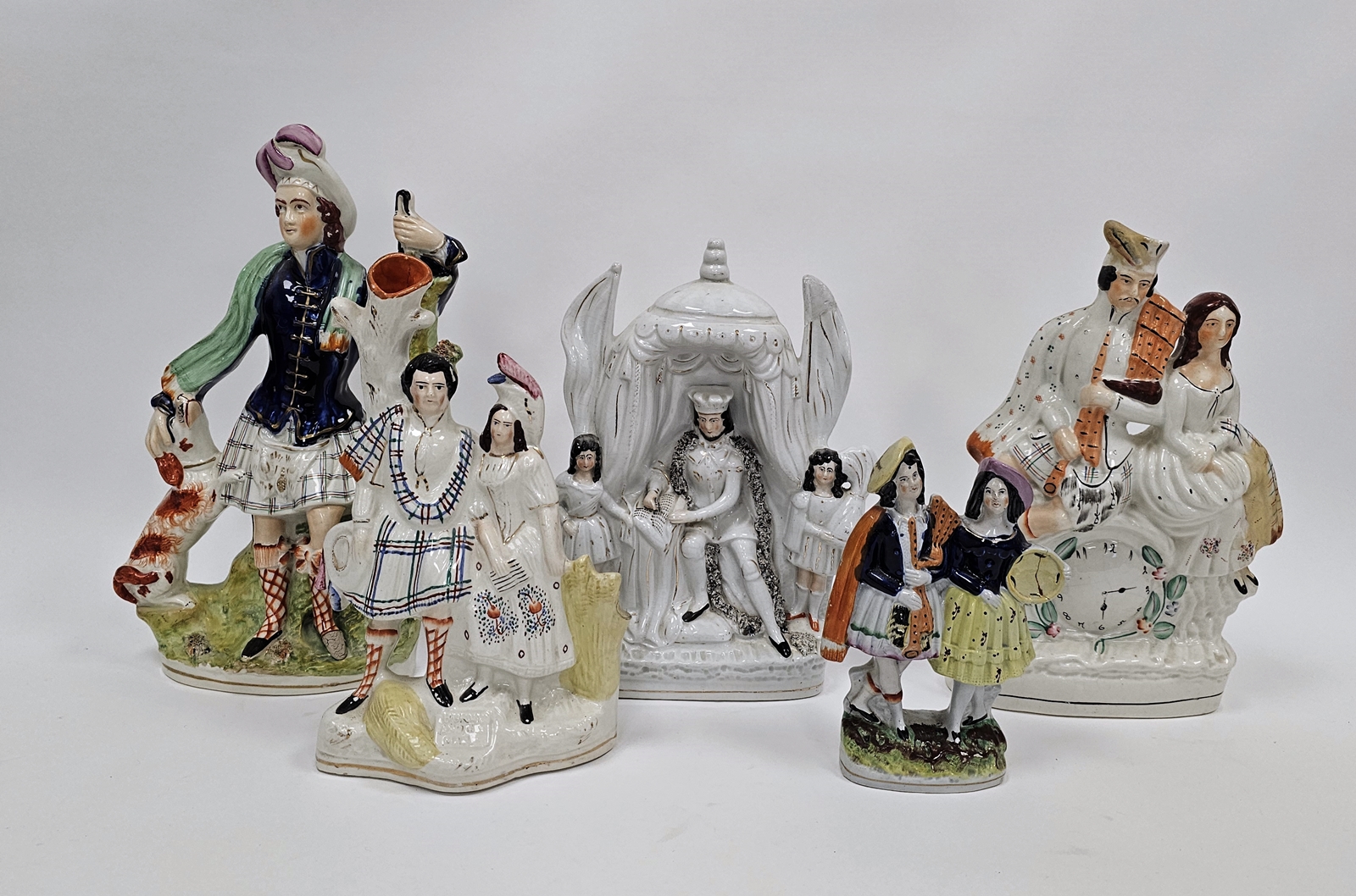 Group of Victorian Staffordshire pottery flatback figures including a group of King John signing the