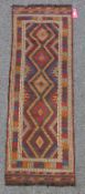 Eastern kelim wool runner with five lozenges and multiple geometric stripes in red, green and