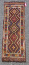 Eastern kelim wool runner with five lozenges and multiple geometric stripes in red, green and
