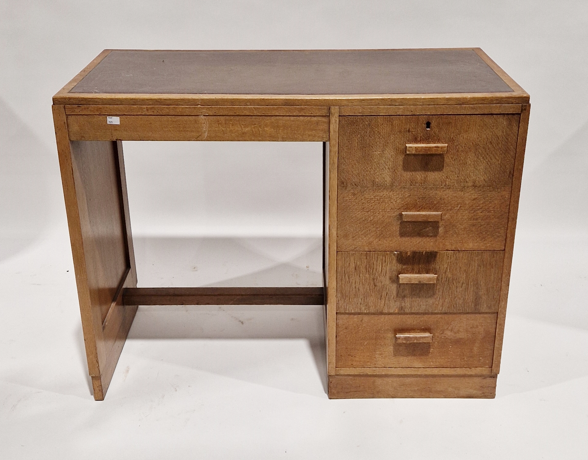 AB Good Furniture Units mid century golden oak desk, the rectangular top inset with brown leather