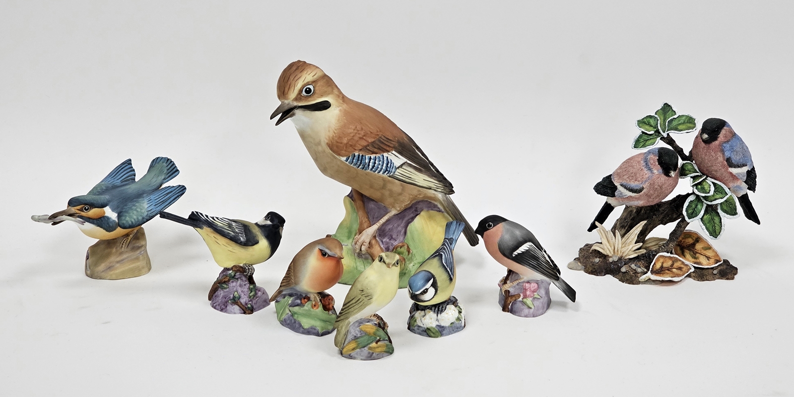 Group of Royal Worcester models of birds and others similar, including a wood warbler, a blue tit, a