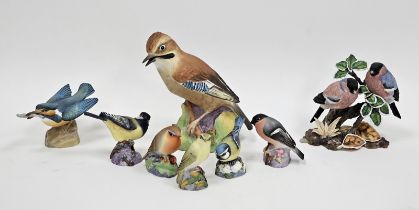 Group of Royal Worcester models of birds and others similar, including a wood warbler, a blue tit, a