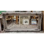 Large 20th century silver painted carved wall mirror of rectangular form, with bevelled edge,
