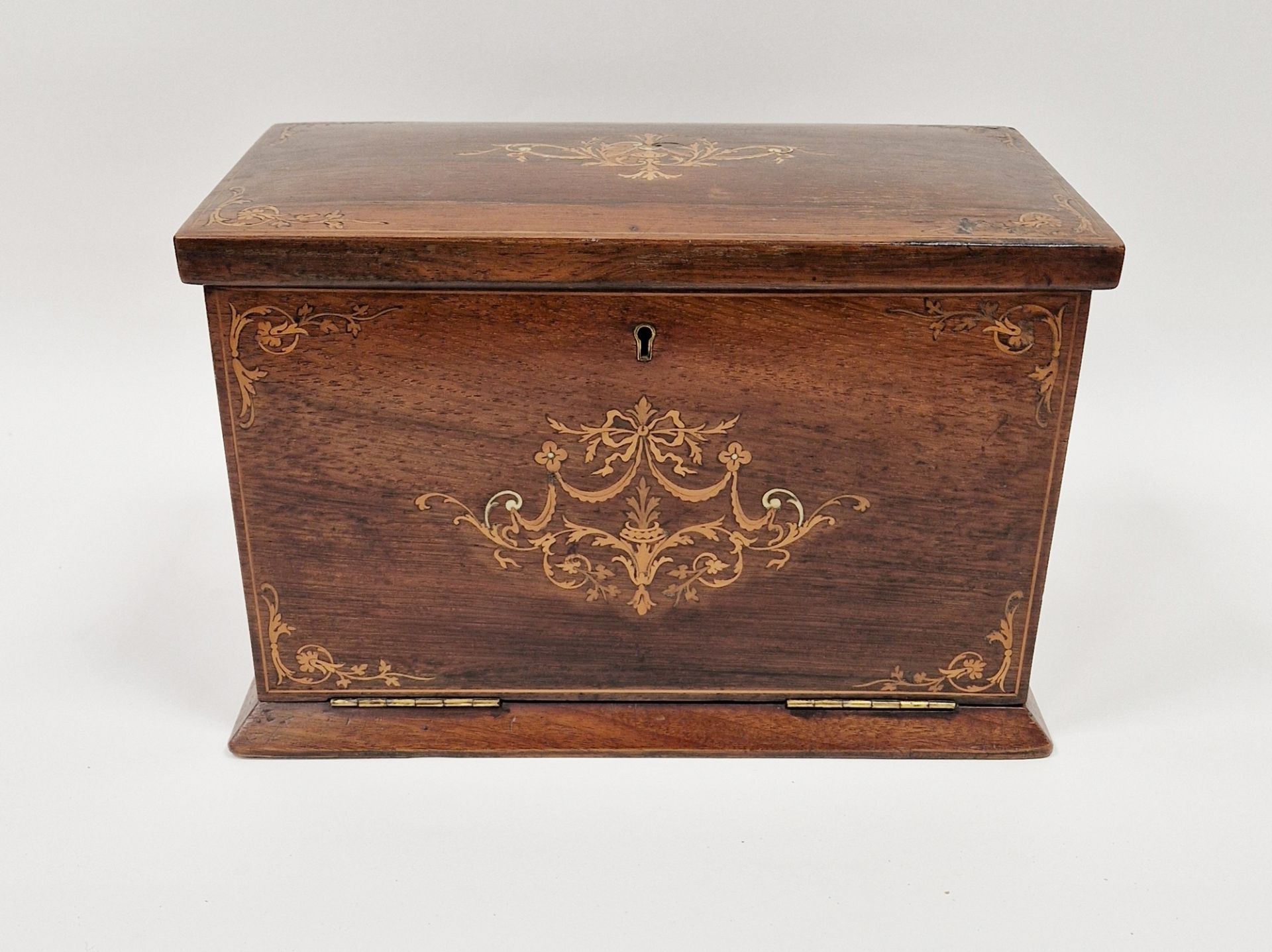 Edwardian marquetry inlaid fall-front stationery casket, the front with leather lined fold-out