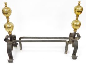 Pair of 19th century wrought iron and brass-mounted fire dogs, each with double brass knop