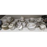 Three English porcelain and bone china part tea services comprising a New Chelsea Staffordshire
