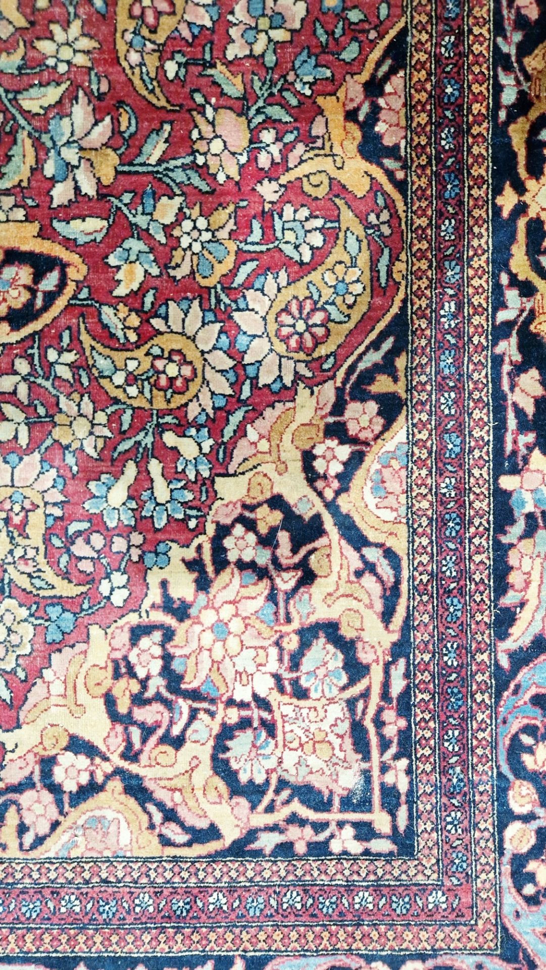 Eastern wool rug of Persian design, having black arabesque to the cherry red field with allover - Image 7 of 32
